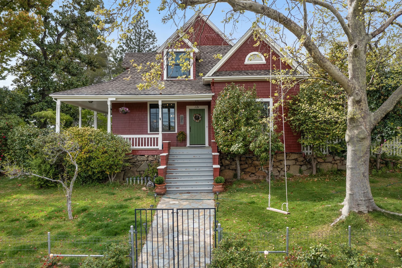 Craftsman-style home with red siding and front porch